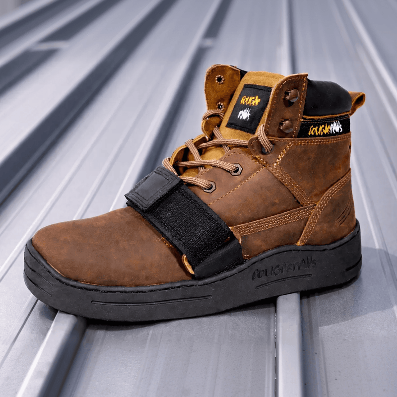 Cougar Paws metal roof boot with a hook-and-loop strap on a standing seam metal roof